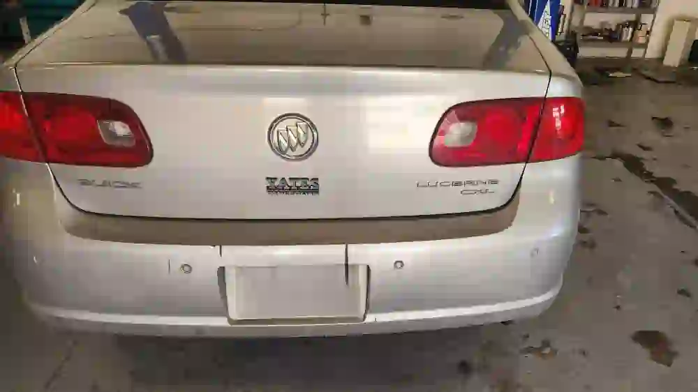 Buick Lucerne parked inside T Autocare Takedown after repairs in Broken Arrow