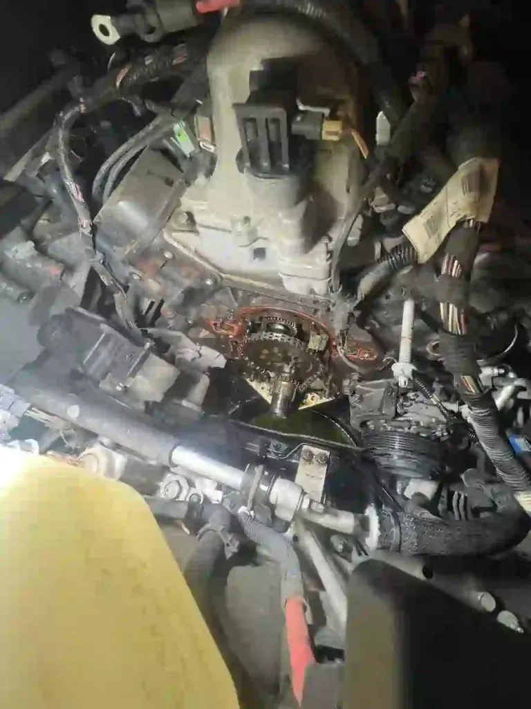 Close-up of timing cover area showing coolant leak on a 2007 Buick Lucerne