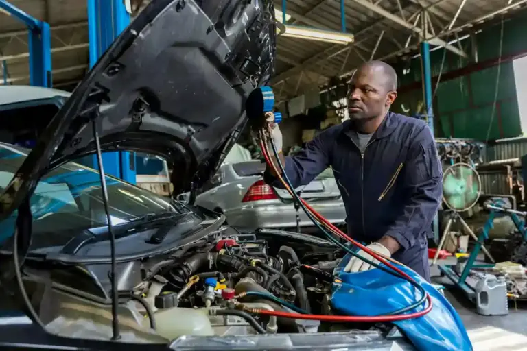 mechanic doing auto ac repair in Broken Arrow