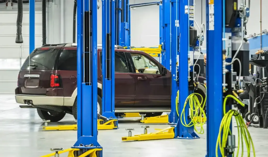 Car on an Automotive Lift During Scheduled Maintenance