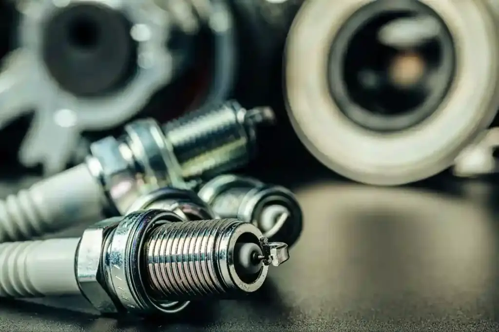 Car spark plugs on black background close up