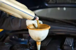 car workshop, car oil change in a garage by a car mechanic