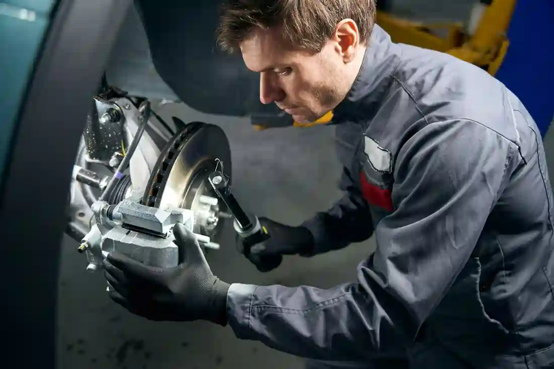 Mechanic doing inspection of the brake system