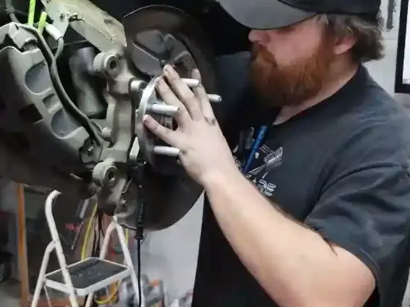 Broken Arrow mechanic doing a wheel bearing replacement